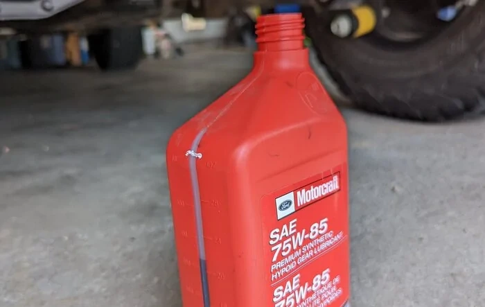Double check your rear diff factory fluid level.