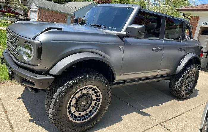 Carbonized Gray XPEL Stealth PPF Wrapped Badlands, 20" Fuel Wheels, 37" Nitto Ridge Grapplers, 4" Lift.