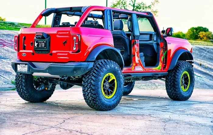 My Badlands Race Red on 38's, 17" RTR wheels, 4.5" custom lift, custom steps & graffiti