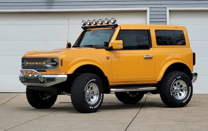 Retro Cyber Orange Bronco with chrome bumpers 2-door build