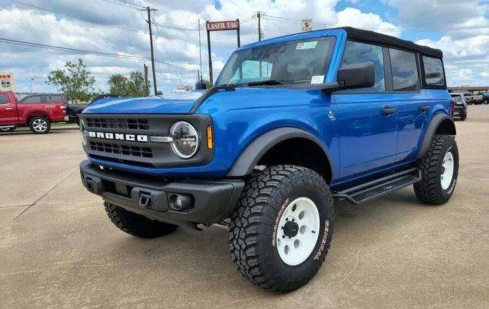 Blue Black Diamond Bronco with white ProComp wheels, RC 3.5 inch lift, 35" General Grabber X3, and more...