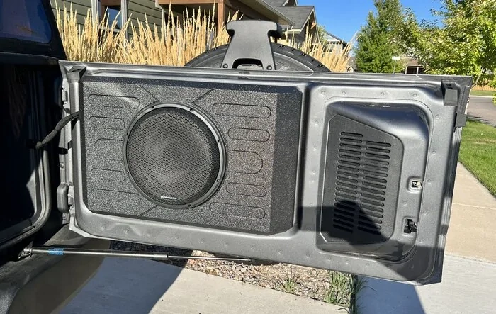 Stinger 12” sub box mounted on back tail gate