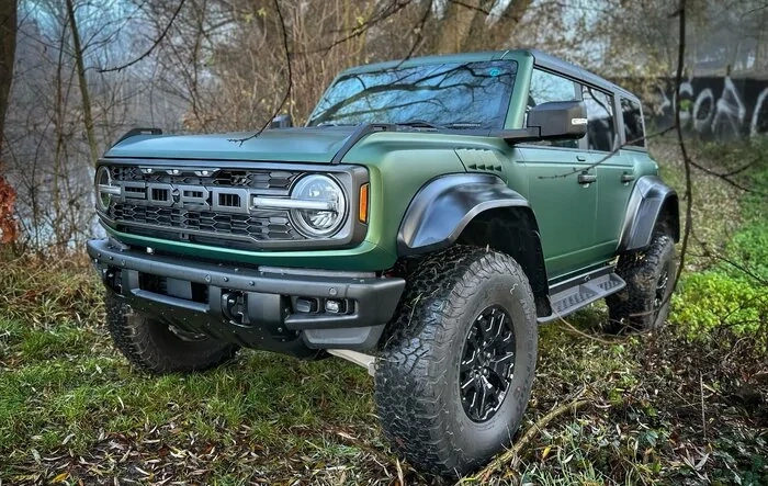 Eruption Green Bronco Raptor wrapped in satin stealth PPF wrap with black bumper