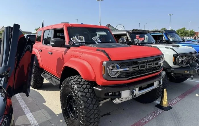 Red bed liner sprayed Bronco Raptor