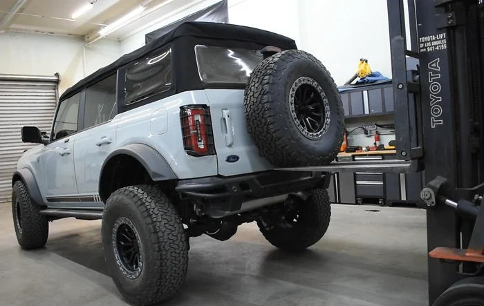 Lifting our Bronco by the Tire Carrier (by Turn Offroad) with a Forklift