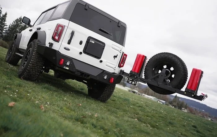 Rear swing-out bumpers are now taking orders!  $500 off promo.   Get that tire off your back door and carry 11gal more fuel!