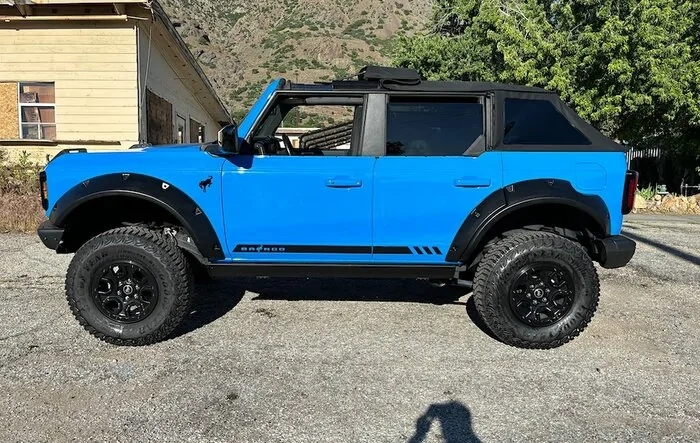 Bushwacker flares installed on custom paint Grabber Blue Bronco