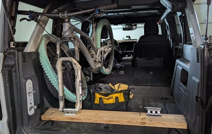 Got Bikes? Cheap, safe bike storage! DIY fork holder rack using a 2x6